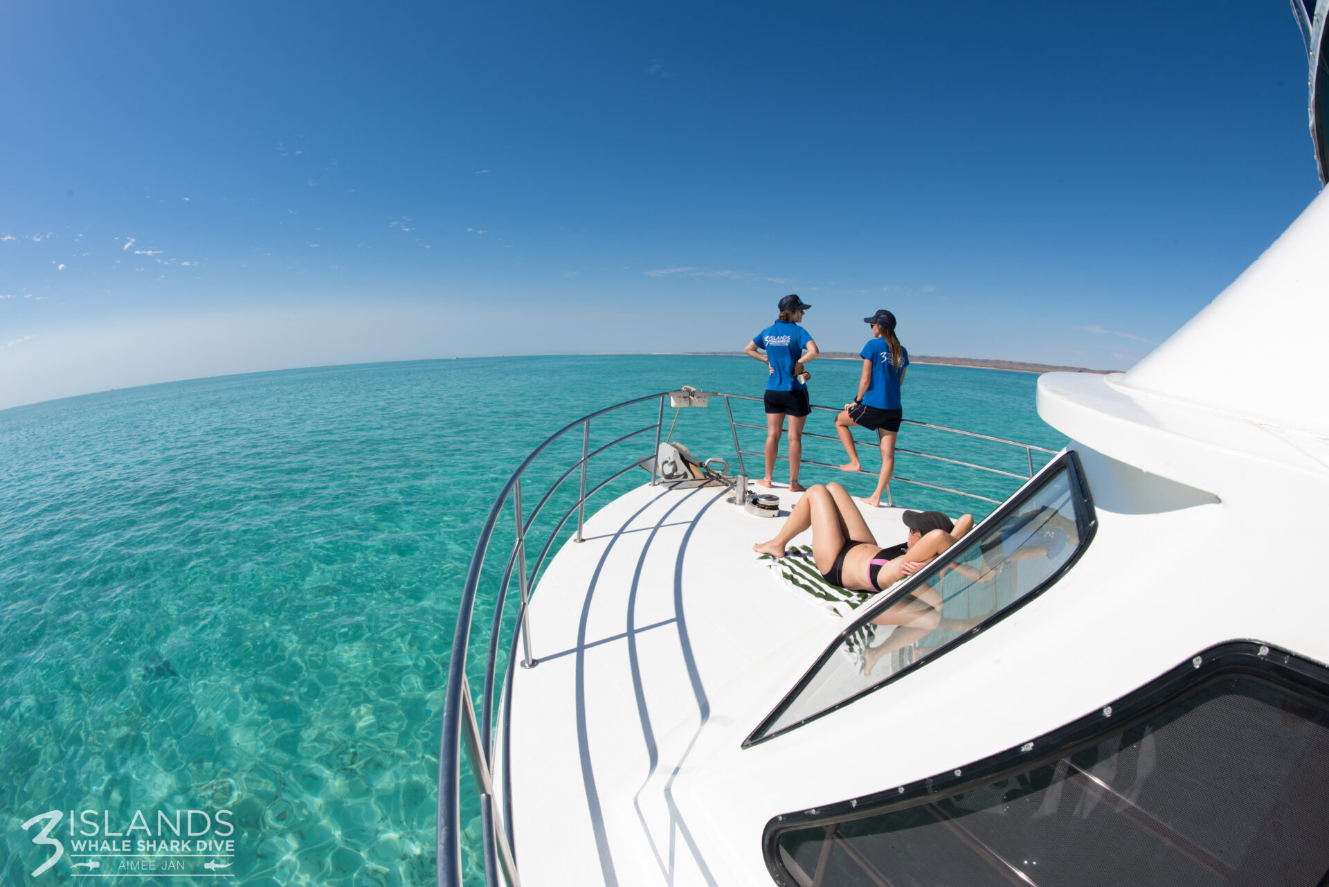 Crew and Customer In Front of the Yacht Included in the Whale Shark Tour